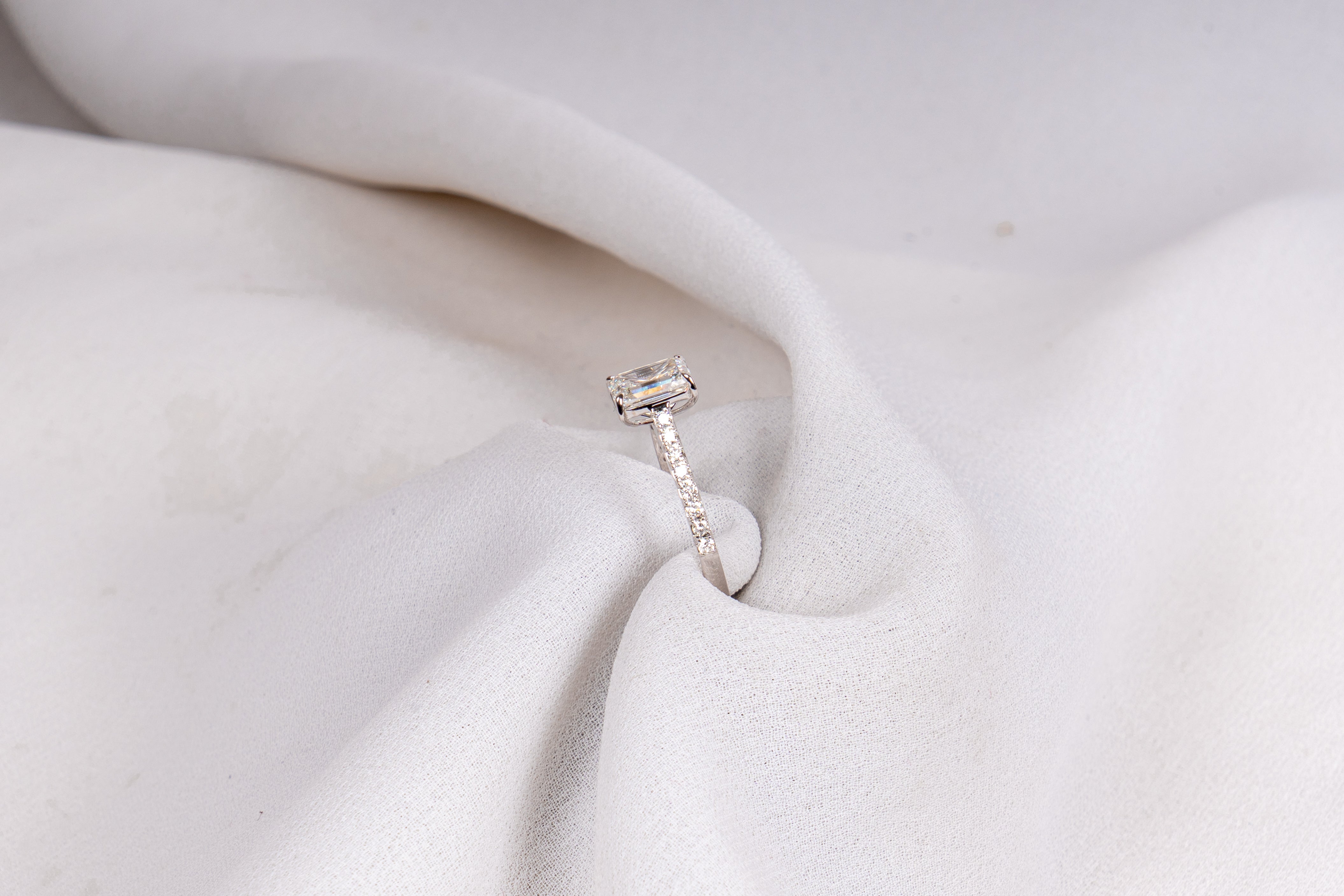 Emerald Cut Solitaire Pavé Engagement