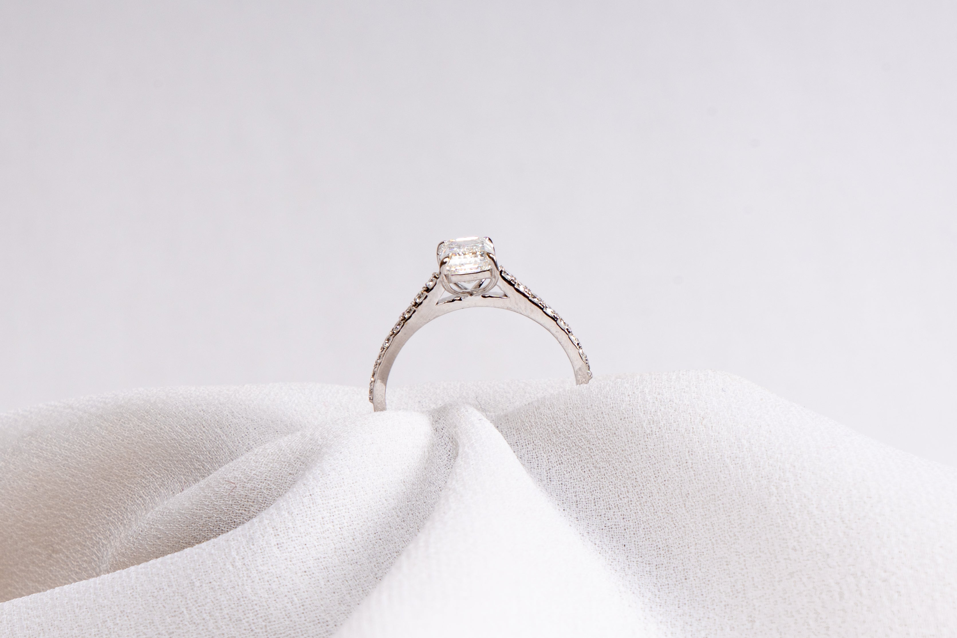 Emerald Cut Solitaire Pavé Engagement