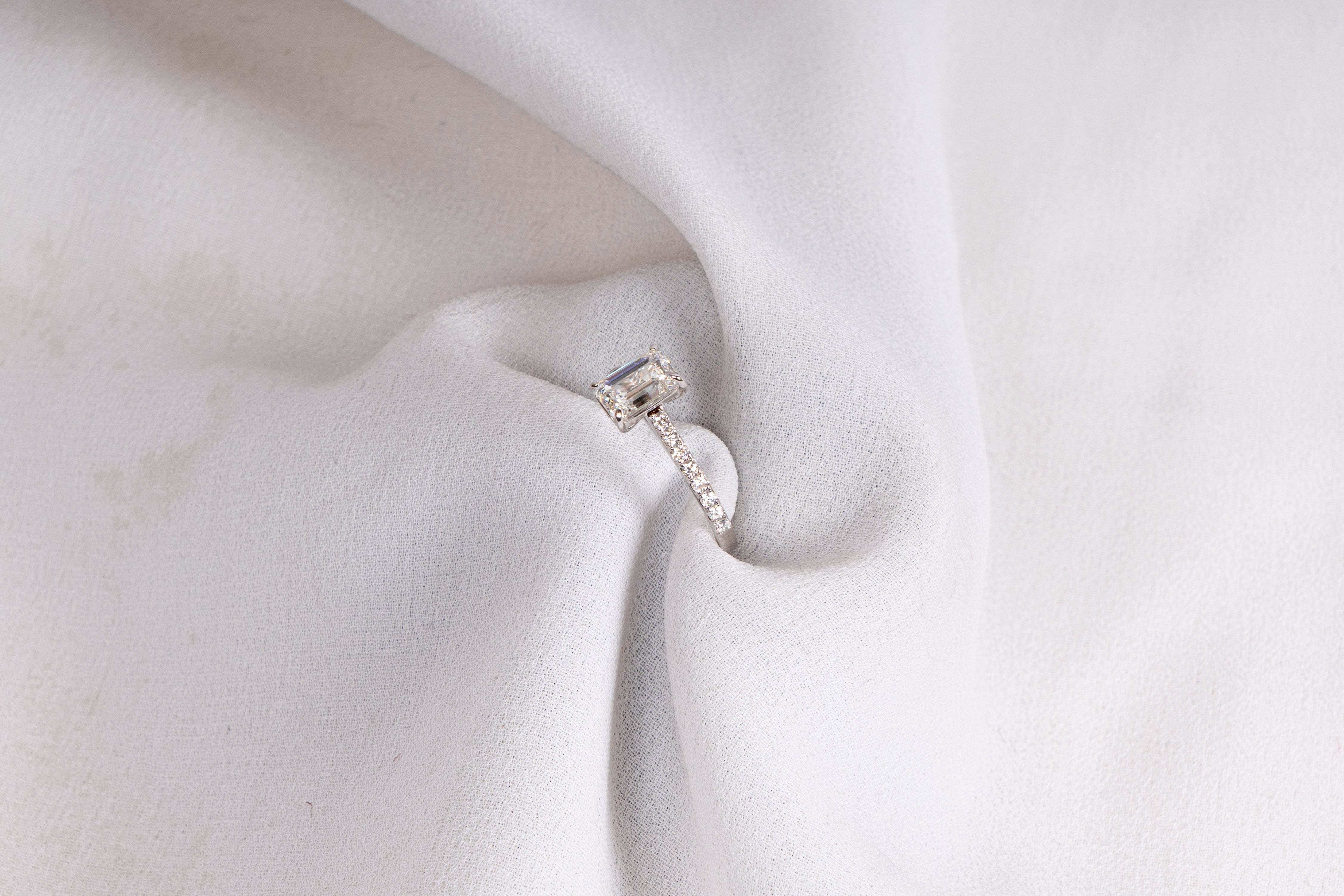 Emerald Cut Solitaire Pavé Engagement